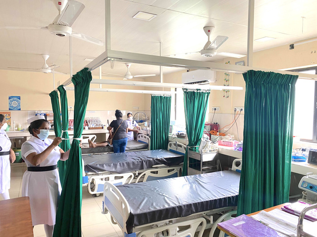hospital room with curtains between the beds